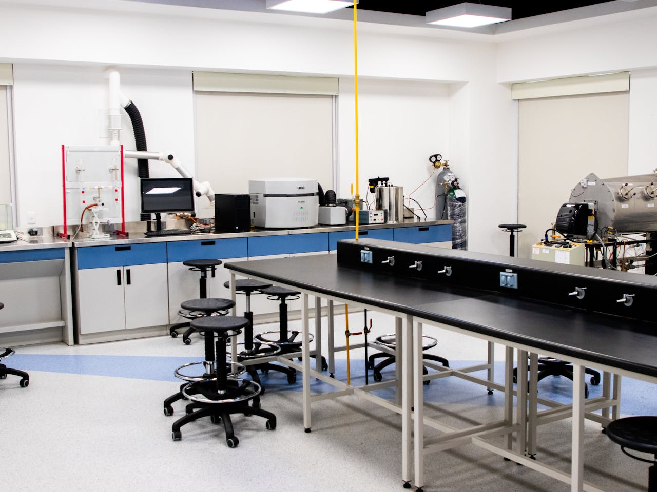 Spacious research laboratory interior with advanced equipment and modern furnishings.